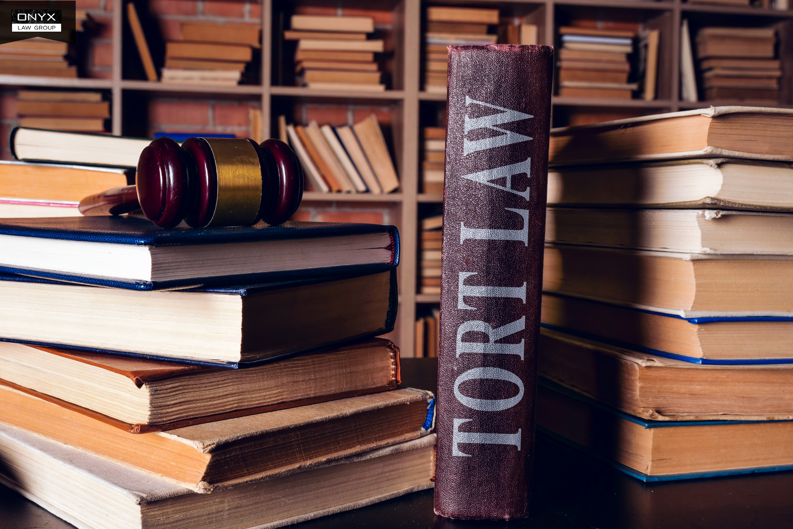Tort law book and gavel representing legal remedies for victims of family violence in British Columbia